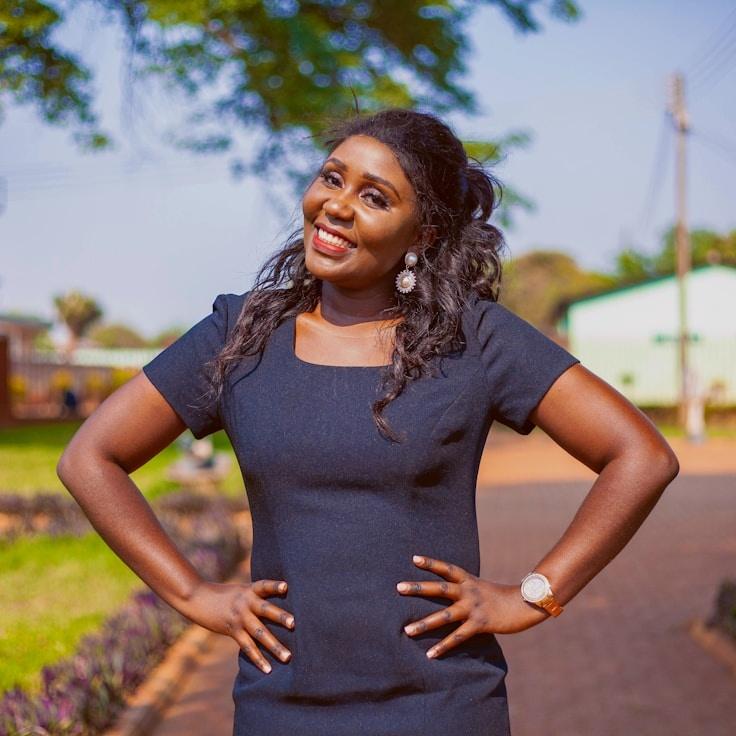 Ariya Malik, Lead Design Curator at GoldenSunsetValley, reviewing corporate floral arrangements